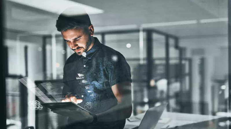 man holding a computer